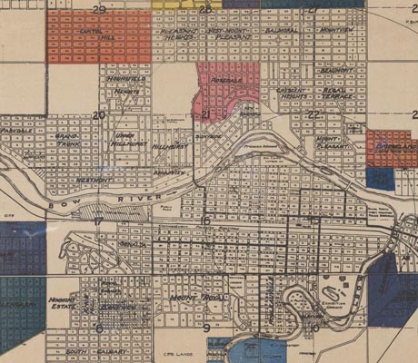 A vintage map of Calgary from the early 20th century, showing the citys layout with streets, neighbourhoods, and the Bow River. 