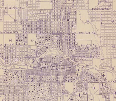 A vintage mapy of Calgary with a grid layout, depicting streets, avenues and the Bow River, likely from the mid-20th century.