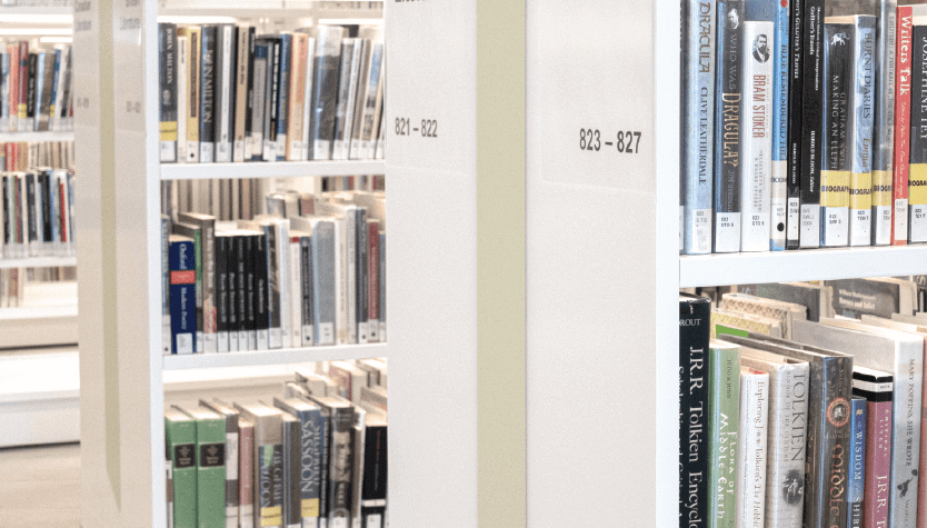 Photograph of bookshelves filled with various books.