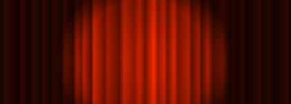 A red theatre curtain with a spotlight highlighting the center.