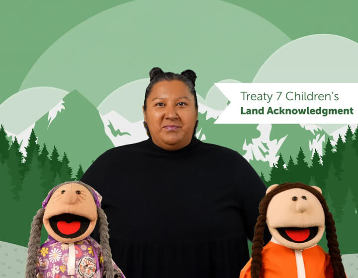 background image: A photograph of Henry and two puppets. Behind them is a illustration of green mountains and trees and it says Treaty 7 Children's Land Acknowlegment.