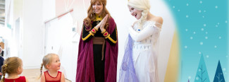 Two girls in red dresses with two women dressed as characters from the movie Frozen.